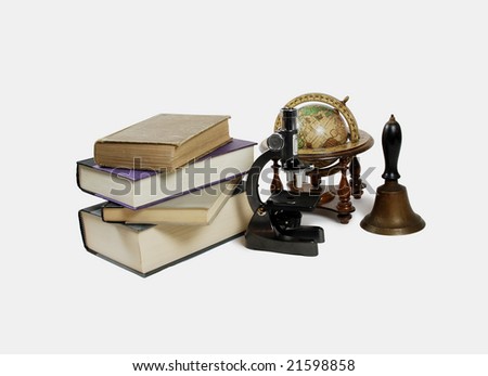 Small Microscope used in scientific research, book, old world globe