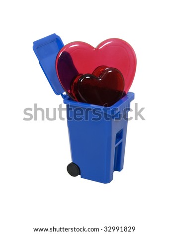 Red and pink glass hearts symbolizing love and romance in a recycling bin - path included