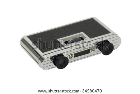 Closed compact silver opera glasses used to view distant events - path included