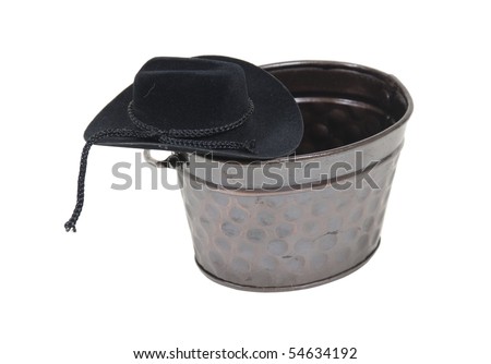 At the watering hole shown by a cowboy hat on a metal watering trough - path included