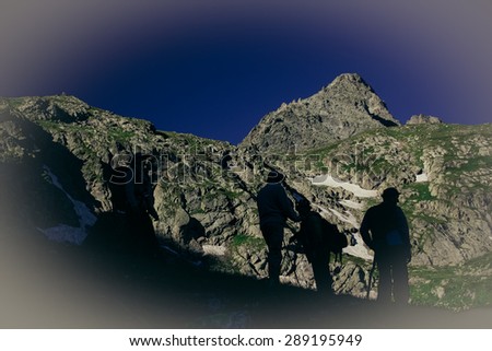 Travelers in the mountains. Mountain landscape and people on the road