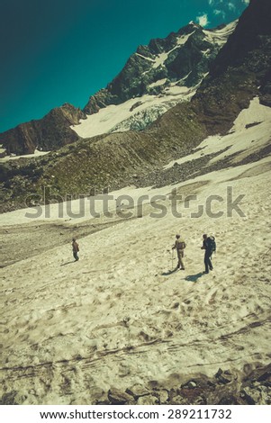 Travelers in the mountains. Mountain landscape and people on the road