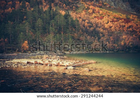 Scenery of high mountain with lake and high peak on a clear day. Pure mountain water. Clear mountain lakes in the Alpine area.