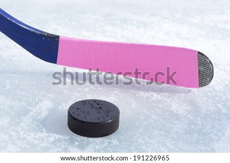 ice hockey stick and puck