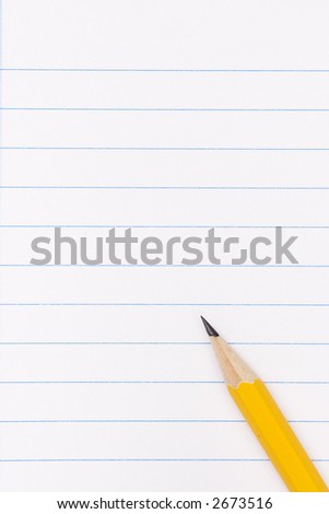 yellow pencil on clean lined notebook