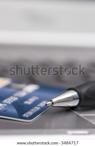 credit card, pen and computer, background