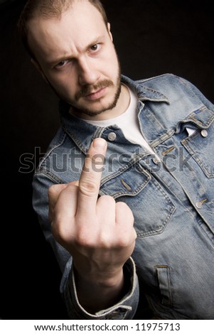stock-photo-young-angry-man-giving-the-middle-finger-black-background-11975713.jpg