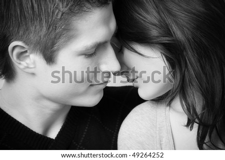 young couple in love, face to face in black and white