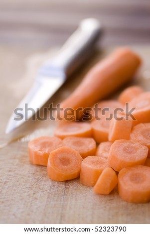 Chopped carrot in circles on cutting board