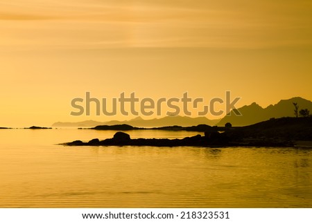 yellow ocean sunset at lofoten islands, Norway