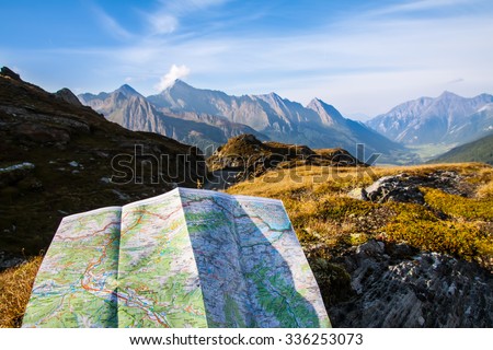 touristic map on Alps mountain and sky background
