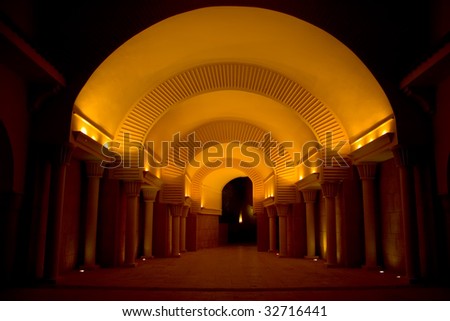 Illuminated dark tunnel with light in the end
