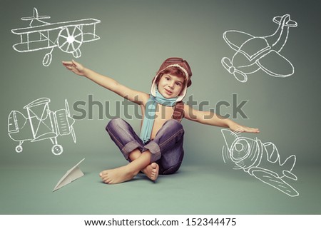 Cheerful Smiling Kid (Boy)L In Helmet On A Green Background. Vintage Pilot (Aviator) Concept