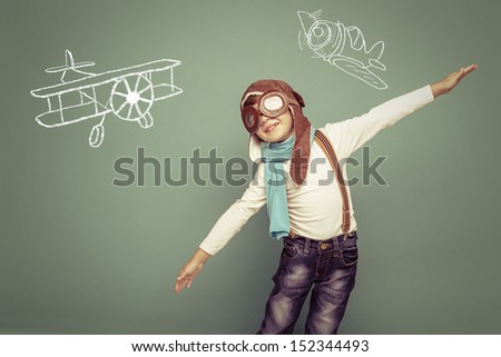 Cheerful Smiling Kid (Boy)L In Helmet On A Green Background. Vintage Pilot (Aviator) Concept