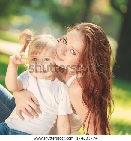 Mother and daughter in the park.   Mother day concept