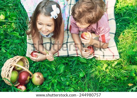 Happy smiling children playing outdoors in spring park. Picnic concept
