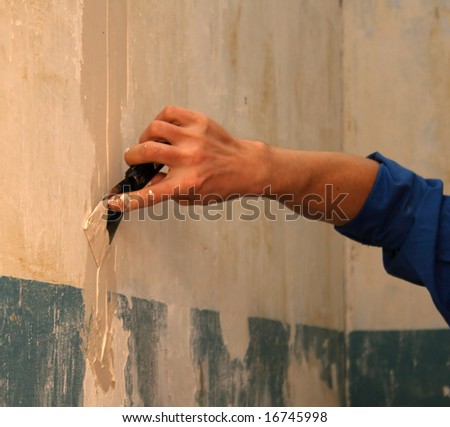 human arm(hand) repairs a wall