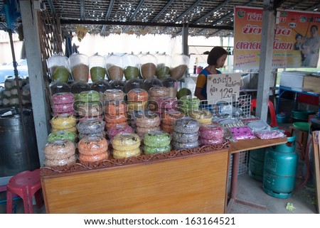 AYUTTHAYA, THAILAND - NOV 2, 2013: The Ayothaya Floating Market. Has a many visitors, both Thais and foreign visitors with varieties of Thai clothes and Thai food.