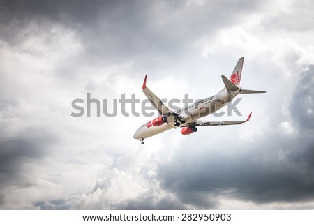 BANGKOK, THAILAND - MAY 20, 2015: HS-LTH Thai Lion Air Boeing 737-900  landing to Don Mueang International Airport Thailand. Thai Lion Air  company is the largest low cost airlines in Asia.