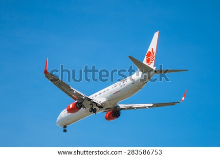 BANGKOK, THAILAND - JUNE 1, 2015: HS-LTK Thai Lion Air Boeing 737-900 landing to Don Mueang International Airport Thailand. Thai Lion Air company is the largest low cost airlines in Asia.