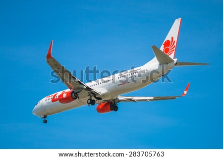 BANGKOK, THAILAND - JUNE 1, 2015: HS-LTQ Thai Lion Air Boeing 737-900 landing to Don Mueang International Airport Thailand. Thai Lion Air company is the largest low cost airlines in Asia.