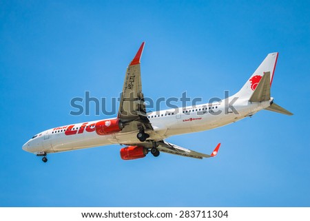 BANGKOK, THAILAND - JUNE 1, 2015: HS-LTL Thai Lion Air Boeing 737-900 landing to Don Mueang International Airport Thailand. Thai Lion Air company is the largest low cost airlines in Asia.
