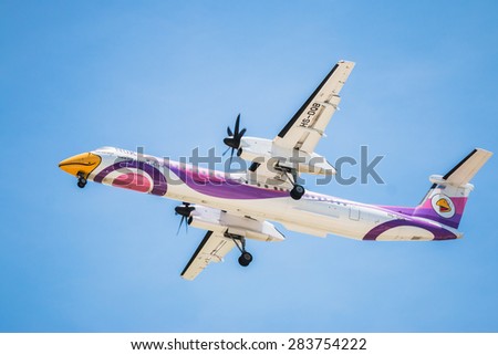 BANGKOK, THAILAND - MAY 20, 2015: HS-DQB Nok Air De Havilland Canada DHC-8-400 landing to Don Mueang International Airport Thailand. Nok Air company is the largest low cost airlines in Thailand.