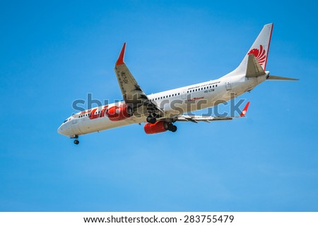 BANGKOK, THAILAND - JUNE 1, 2015: HS-LTM Thai Lion Air Boeing 737-900 landing to Don Mueang International Airport Thailand. Thai Lion Air company is the largest low cost airlines in Asia.