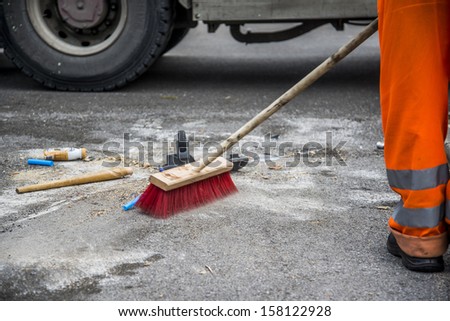 sanitation worker cleaning the street
