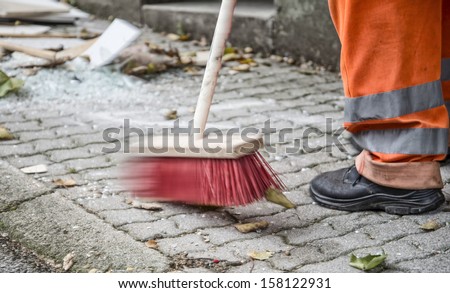 sanitation worker cleaning the street