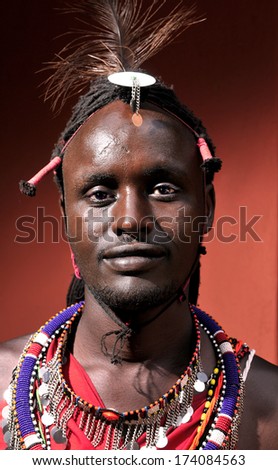 MAASAI MARA, KENYA - AUGUST 10: Maasai man in the village on August 10, 2010. The Maasai are the most famous tribe in Africa. They are nomadic and live in small villages.
