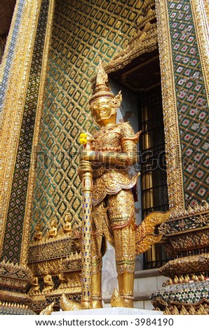 A statue of a demon guardian at the Buddhist temple of Wat Phra Kaeo at the Grand Palace in Bangkok, Thailand.