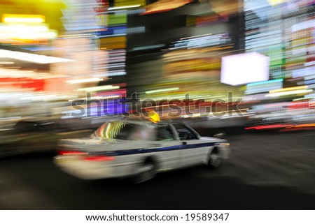 stock photo Colorful abstract panning shot of taxi cab in Tokyo Japan
