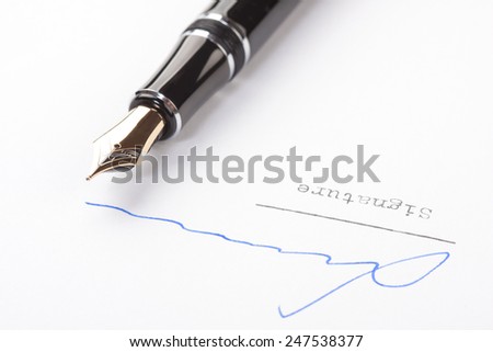 Signature on white paper with old fountain pen