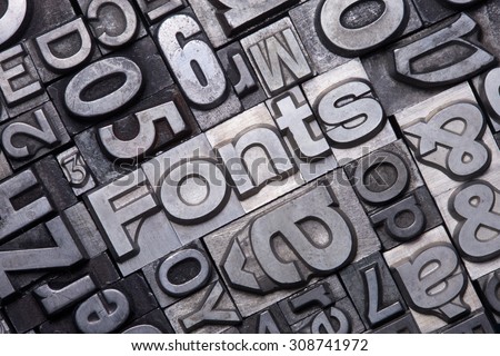lead type letters form the word fonts