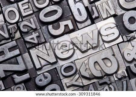 lead type letters form the word news