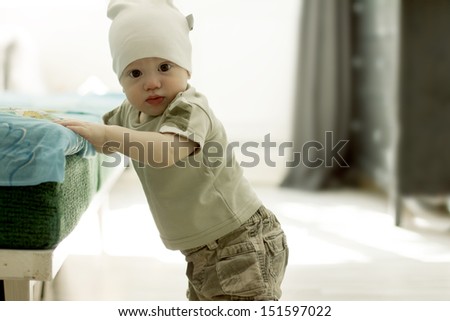 First steps of cute baby boy