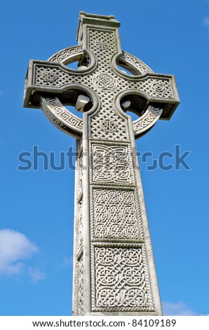 Pre 1900 irish celtic cross with traditional celtic carving on a grave in the famous Milltown Cemetery Belfast, the largest Catholic burial ground in Belfast and synonymous with Irish Republicanism.