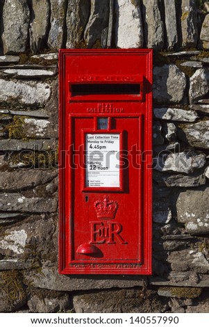 RYDAL, ENGLAND - APRIL 27:  A traditional red English letterbox mounted in a dry stone wall in the village of Rydal in the English Lake District national park pictured on April 27, 2013.