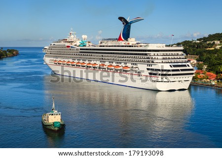 CASTRIES, ST LUCIA - NOVEMBER 7: Cruise ship Carnival Valor docked in Castries on November 7, 2013. The Valor operated by Carnival Cruises whose maiden voyage was in 2004 was built at a cost of $500m.