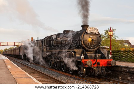 APPLEBY, ENGLAND - MAY 9:  Preserved Black Five steam locomotive number 48151 at the head of The Highlands and Islands Explorer in Appleby, England on May 9, 2014, on the Settle to Carlisle railway.