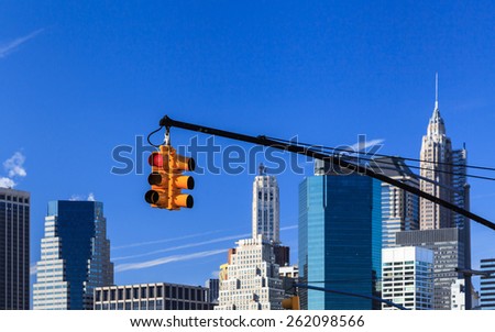 New York City Traffic Light.  A set of traffic lights in New York City with the Manhattan skyline in the background.
