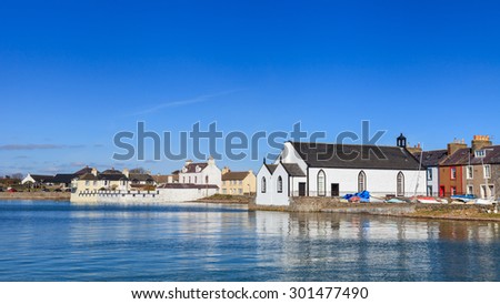 Isle of Whithorn Waterfront.  The view across Isle of Whithorn Bay to the small coastal village of Isle of Whithorn in Dumfries and Galloway, Southern Scotland.