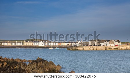 Isle of Whithorn Harbour.  The view across Isle of Whithorn Bay to the small coastal village of Isle of Whithorn in Dumfries and Galloway, Southern Scotland.