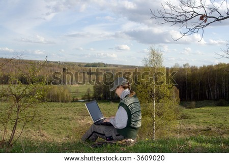 Woman with notebook at nature