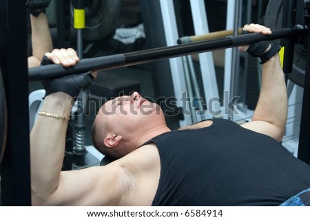 Man works out on a weight bench
