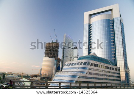 Blue sky at sunrises in city and high-rise buildings under construction.