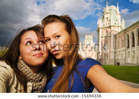 Two young travellers taking pictures of themselves at Moscow landmark Tsaritsino