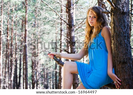 Young beautiful woman at forest