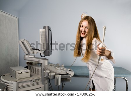 Joyful doctor with ultrasound investigation sensors in hands